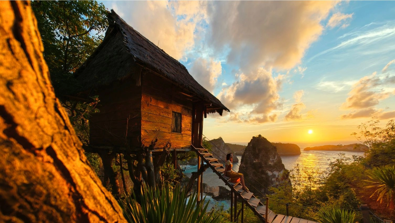 OPPO Find X10 Series campaign landscape with a wooden hut overlooking rocky islands at sunset