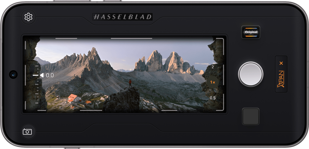 Phone screen displaying Hasselblad XPAN Mode interface framing a mountain landscape