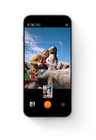 Phone screen demonstrating LUMO Framing auto-composition on a scenic sunset