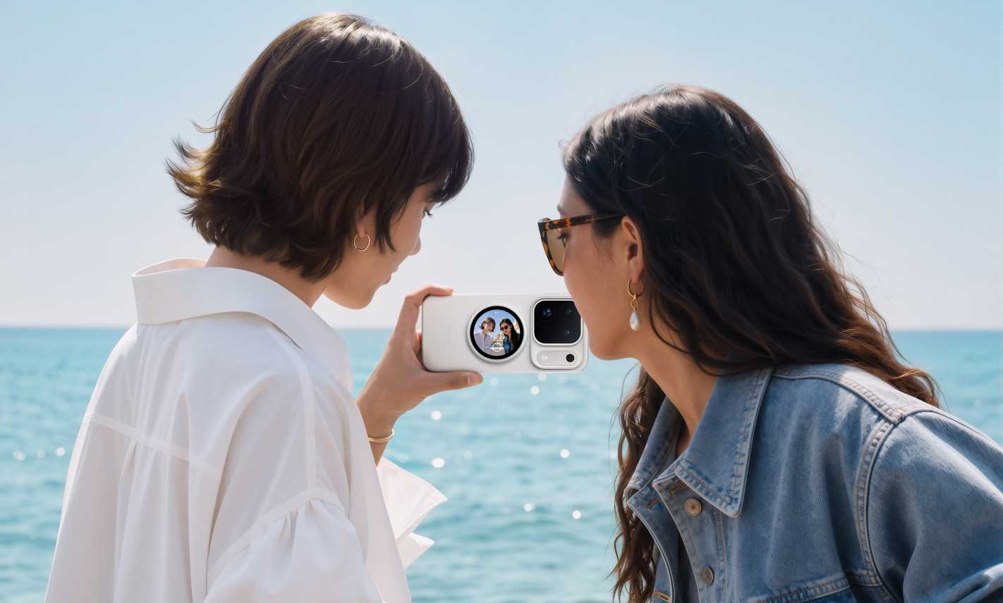 Two friends framing a seaside selfie using the OPPO Bubble rear display
