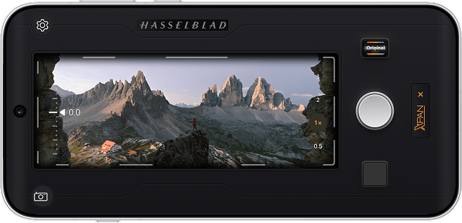 Phone screen displaying Hasselblad XPAN Mode interface framing a mountain landscape