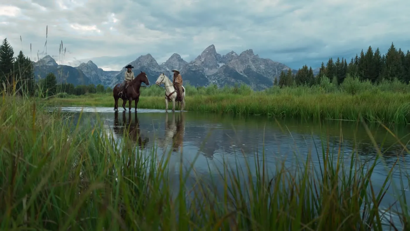 Cinematic river scene with riders and mountains via Open Gate capture