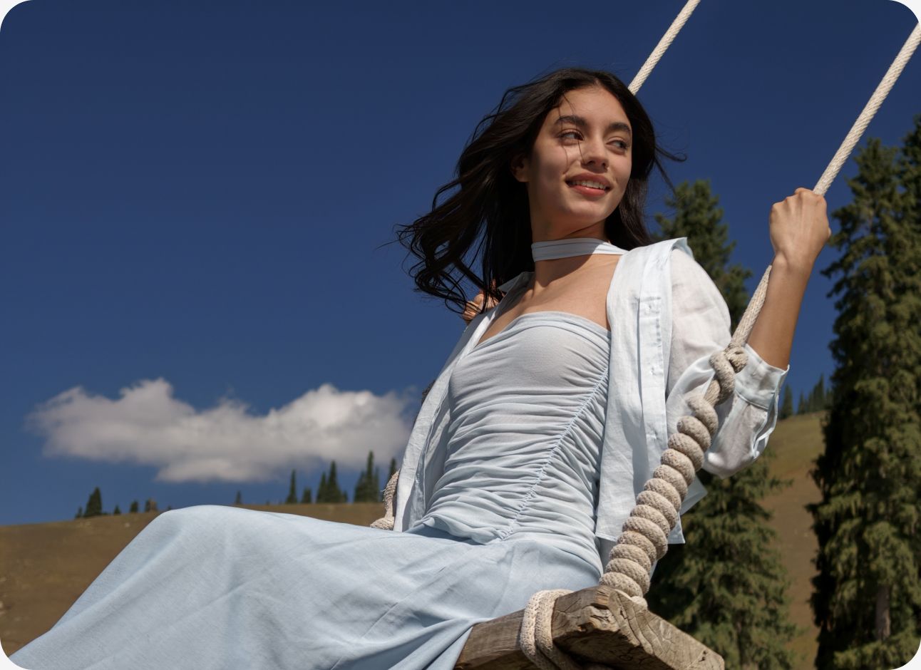 Sharp 3X portrait of a woman on a swing, showcasing fine clothing detail and natural optical bokeh