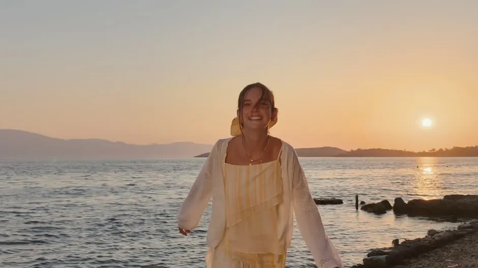 Cinematic HDR video of a woman on a beach at sunset