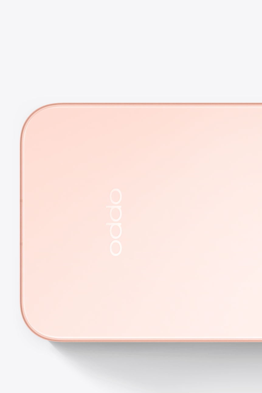 Detail of OPPO Find X10 (Glow Coral) corner, illustrating Velvet Glass finish