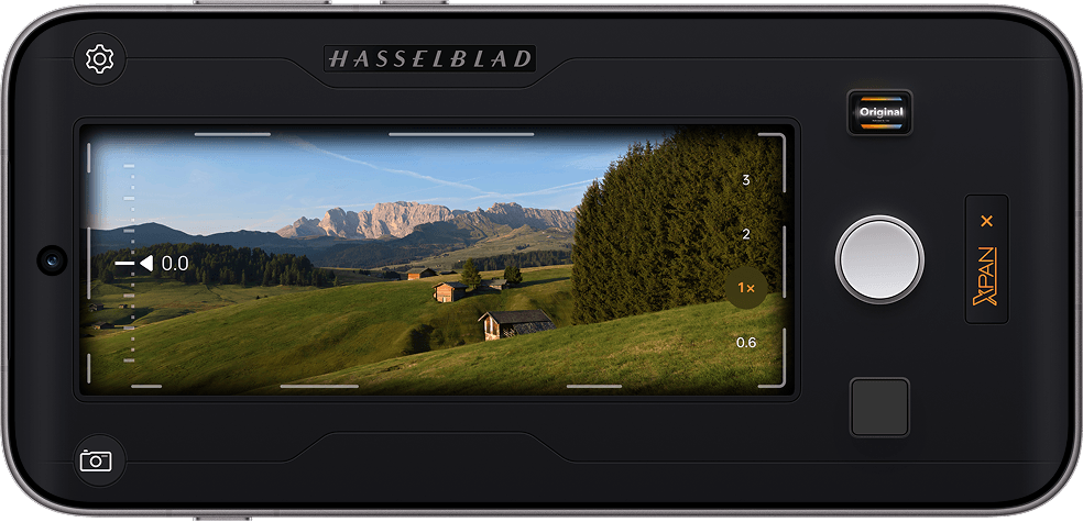 Ekran telefonu wyświetlający interfejs trybu Hasselblad XPAN kadrujący górski krajobraz