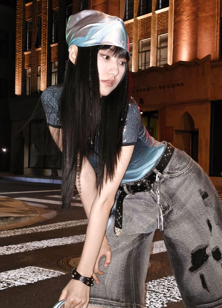 A stylish woman against a vintage city backdrop in as Digicam selfie