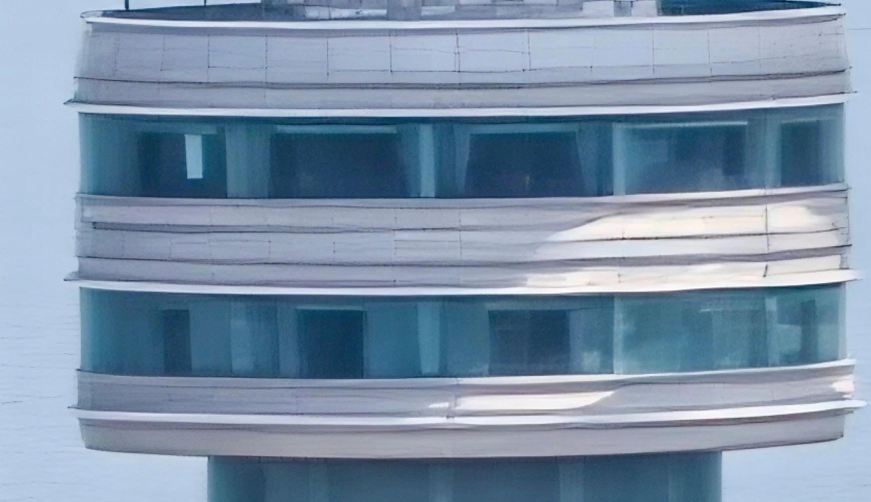 An extreme 120x zoom close-up, showing the structural details of a very distant tower