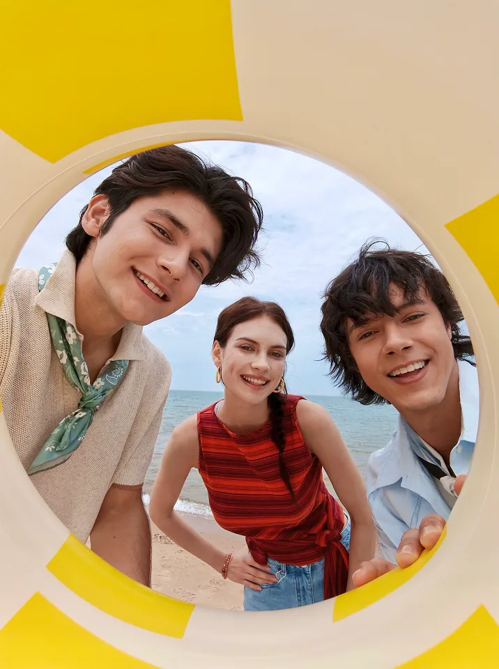 Promotional group selfie composition with friends at the beach